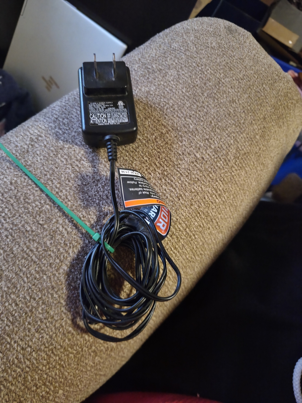 black AC adapter for a Remington charging cord, intended for use with various MB